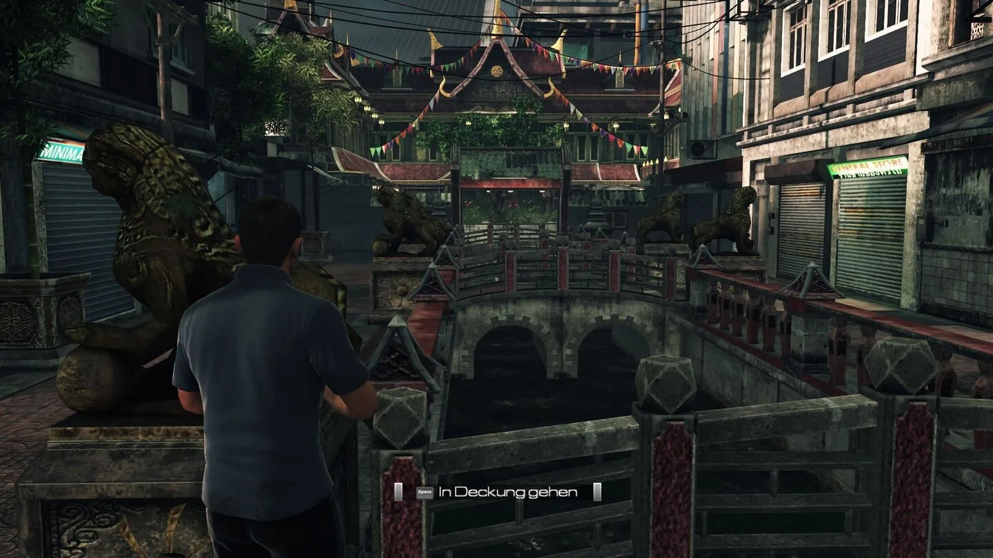 James Bond overlooking a canal bridge, Thai temple roofs and shop signs in Blood Stone's Bangkok level