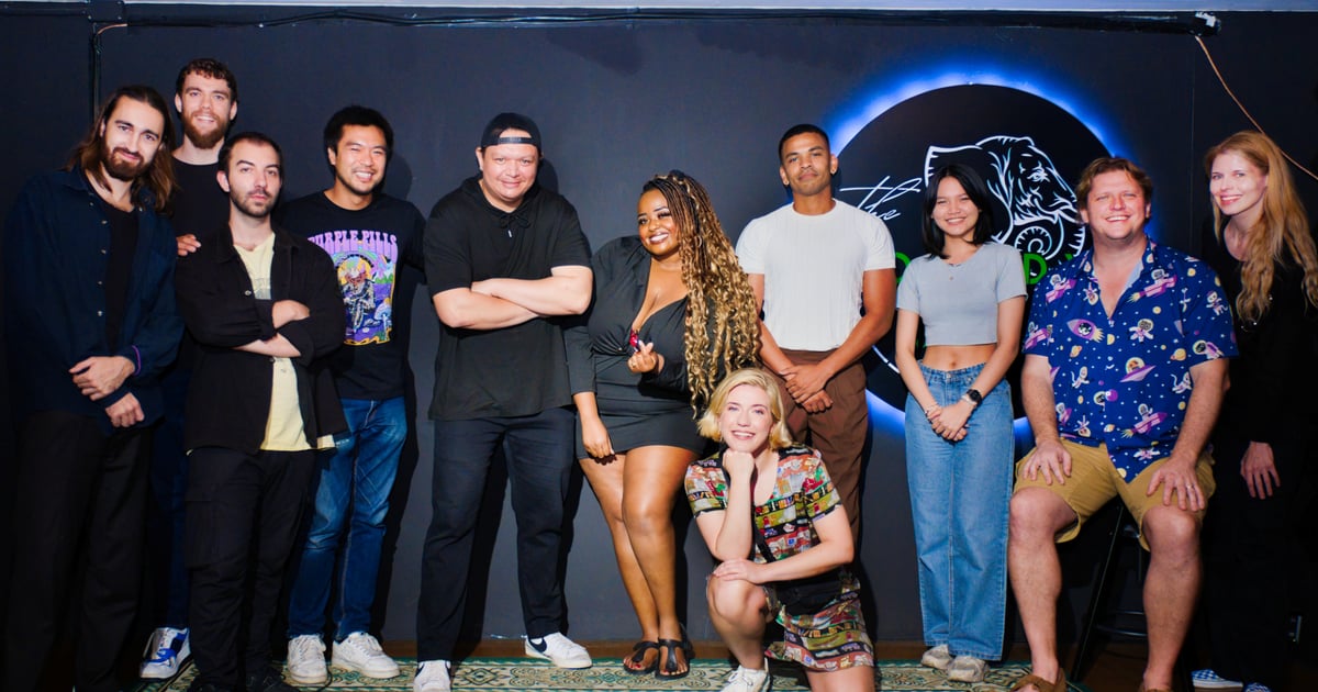 Comedians and The Comedy Joint team posing together on stage
