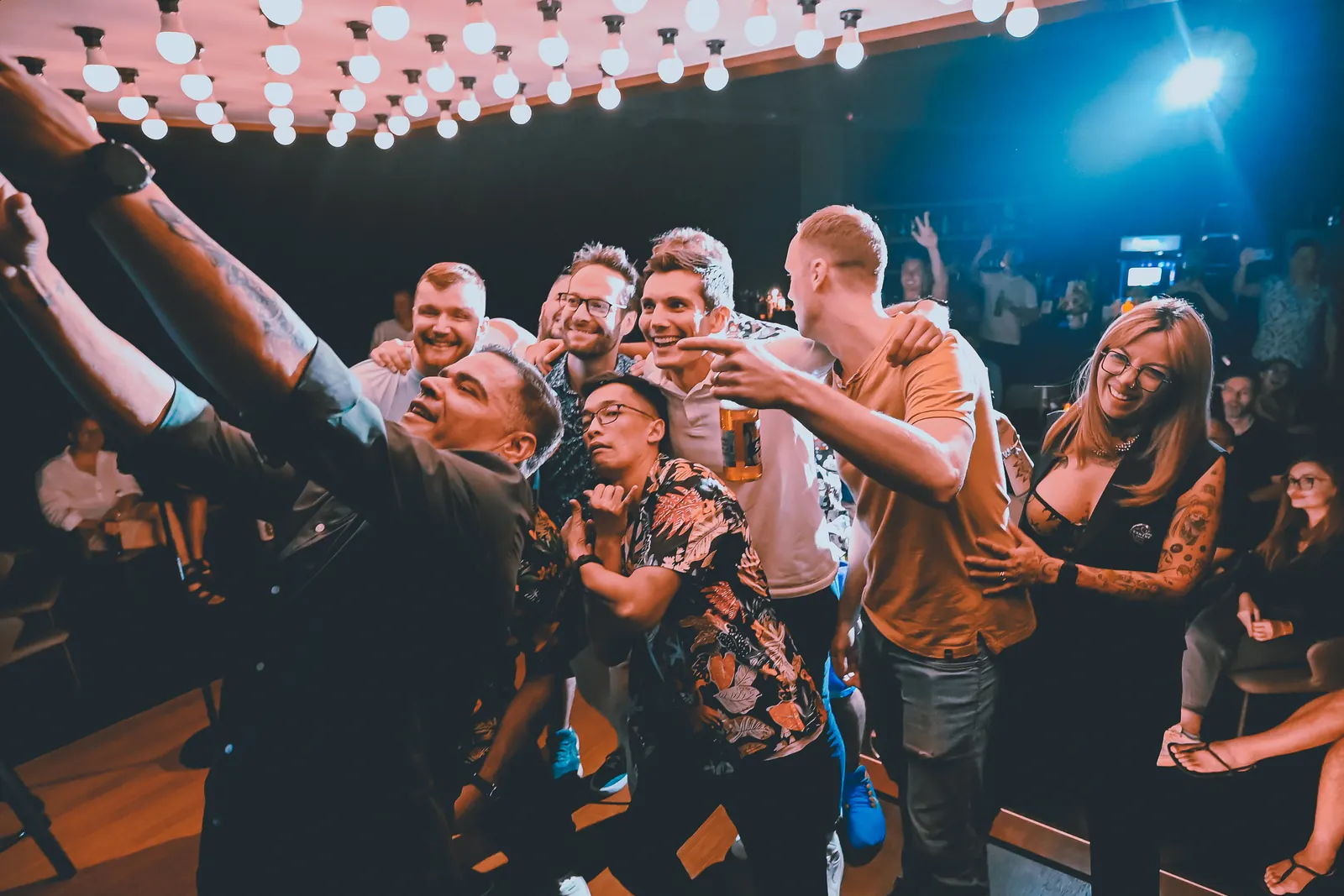 Comedians and audience members taking a photo after the show