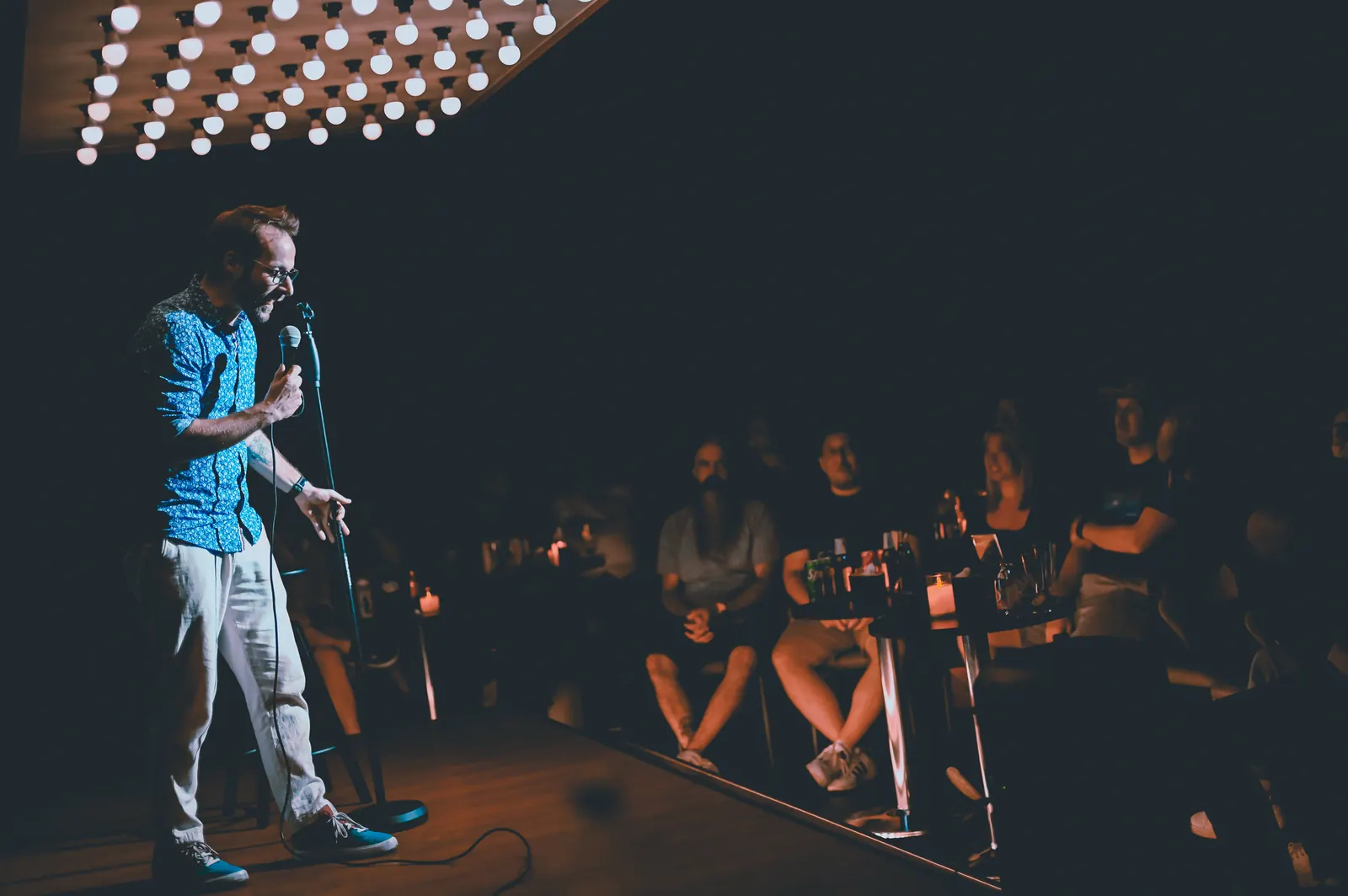 A comedian performing to a Bangkok crowd