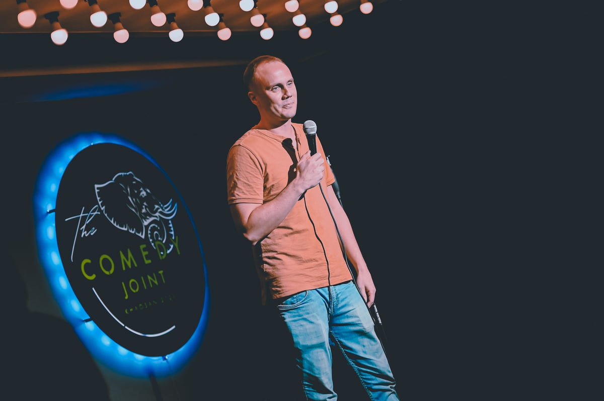 A stand-up comic on The Comedy Joint stage