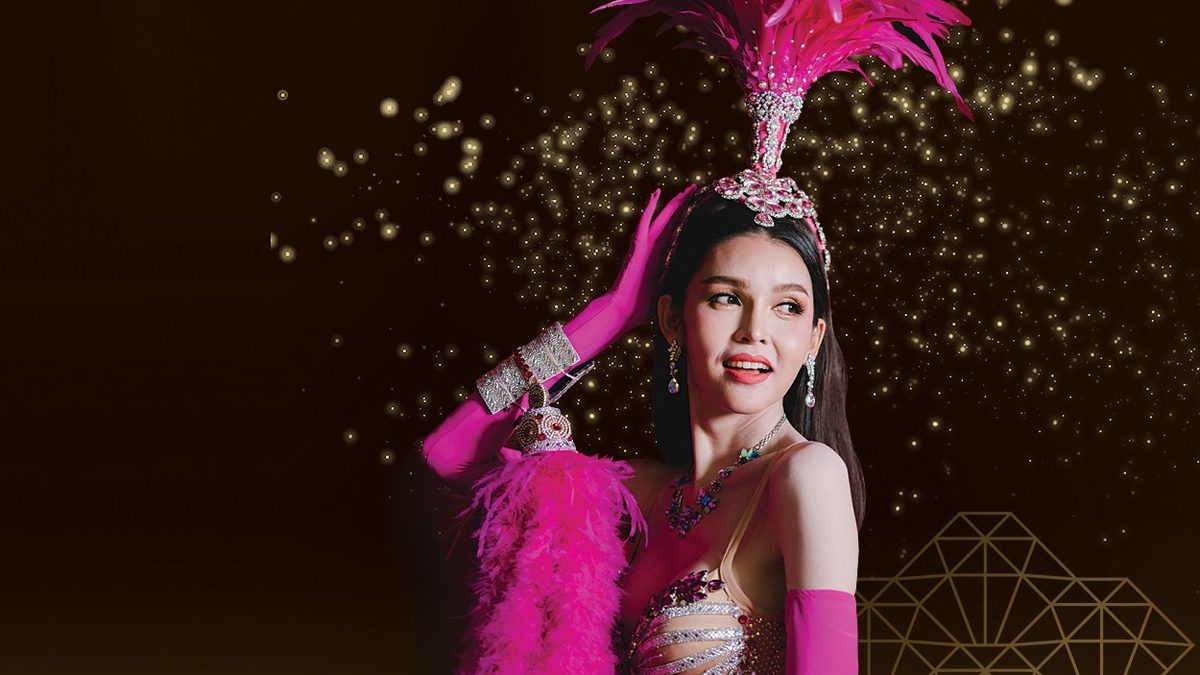 A Golden Dome Cabaret performer in a pink feathered headdress