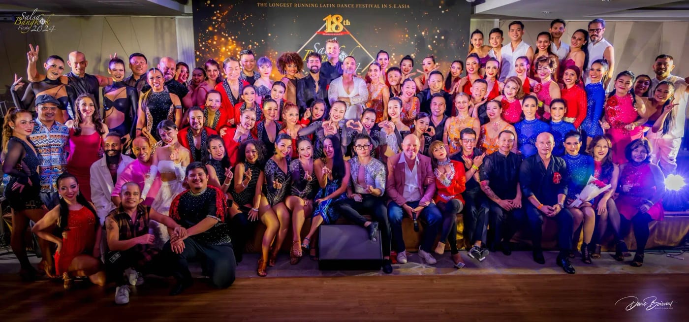 The instructors and performers of Salsa Bangkok Fiesta 2024 posed on stage in costume