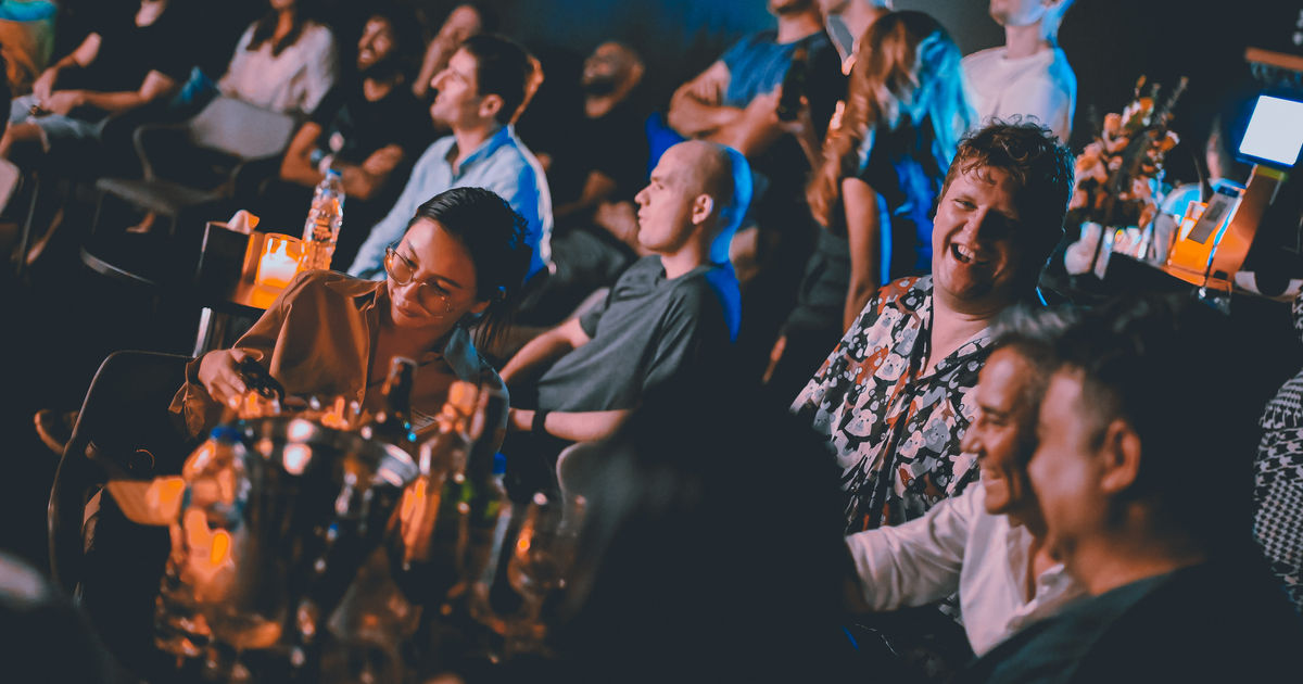 An audience enjoying a Bangkok comedy show