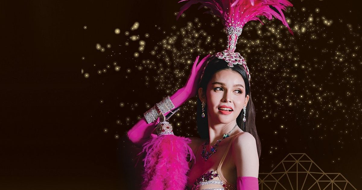 A Golden Dome Cabaret performer in a pink feathered headdress