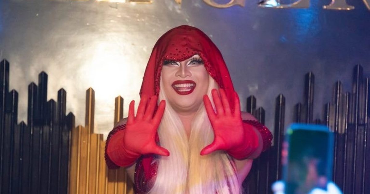 A drag queen in red performing at The Stranger Bar on Silom Soi 4